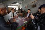 Men play a Chinese card game in Fuli Village