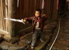 Мальчик из деревни национальных меньшинств Xiaozhai, провинция Guangxi, Юго-Западный Китай