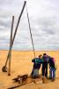 На фотоснимке: Туристы у колодца в астраханской пустыне