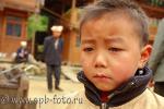 Слезы на глазах китайского ребенка, фотография
